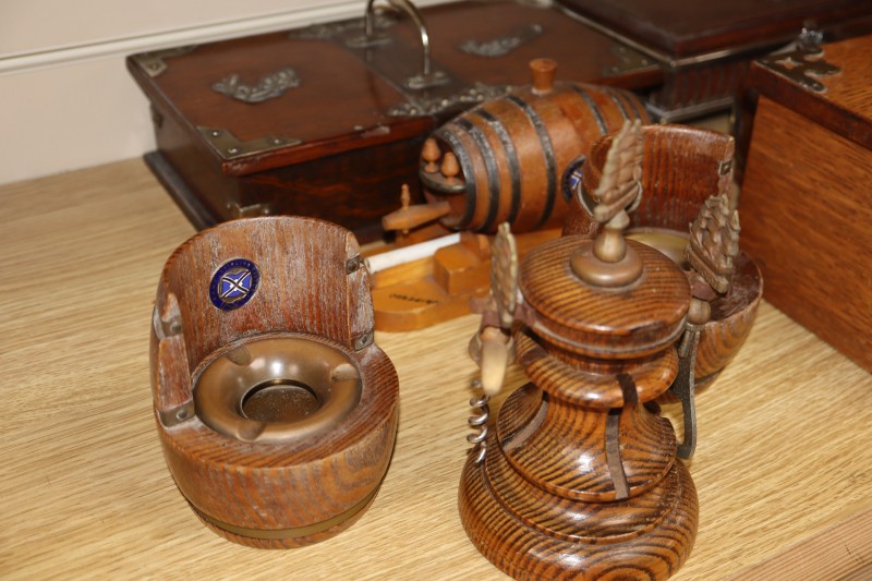 A collection of smoking and drinking paraphernalia including cigar boxes, ashtrays and bottle openers